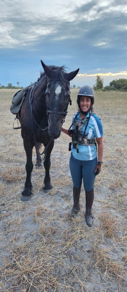 Returning to camp after an evening ride on an African horse riding safari in Botswana.