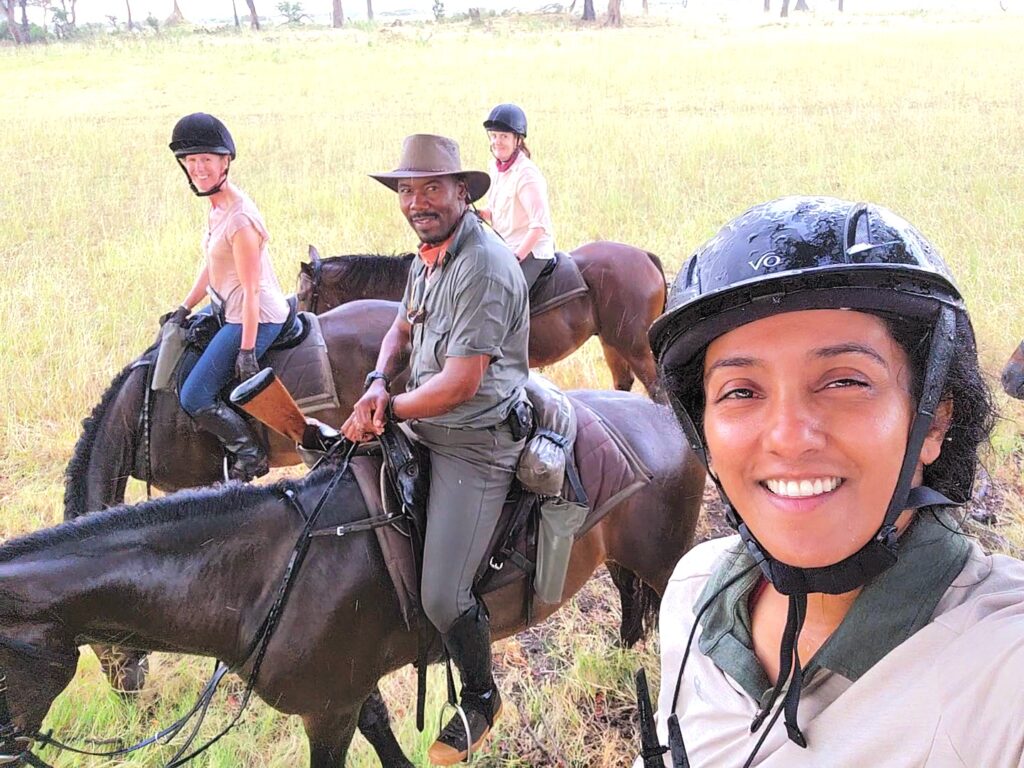 African horse safari guide and group in Botswana